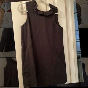 Boutique black dress. Worn once. Tie collar. Ruffle neck linePerfect condition.